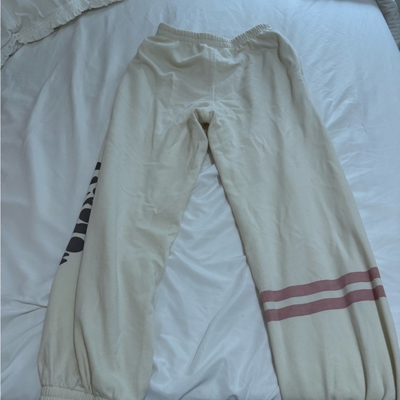 Free People Movement All Star Logo Pants in a cream color. - Picture 8 of 9